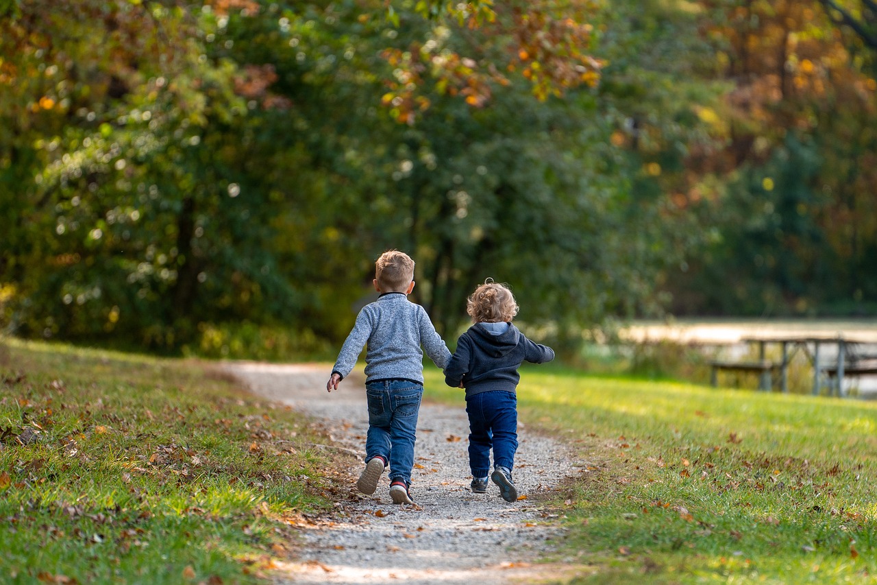 Toddlers running on a path